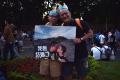 This couple marched in a parade with a picture of themselves that read, “I want to be married.”